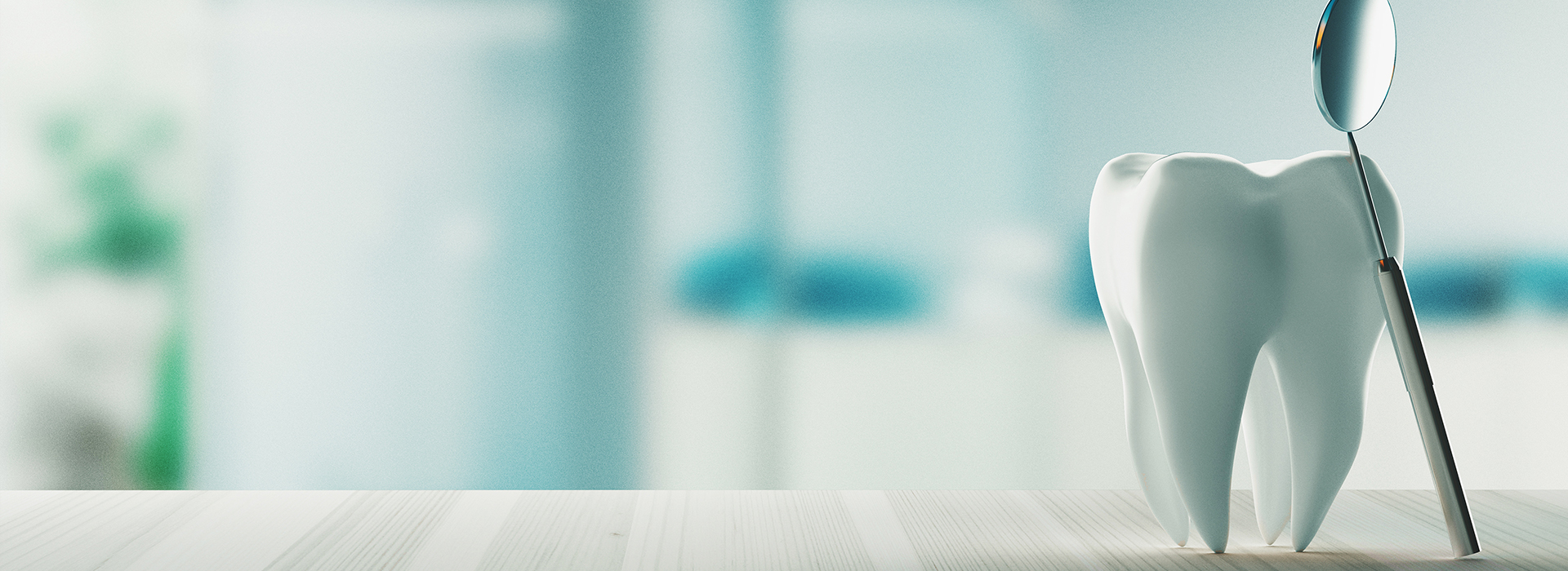 The image shows a toothbrush with toothpaste on it, placed on a countertop in front of a blurred background that appears to be an indoor setting.